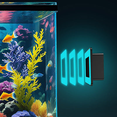 A black rectangular camera device facing a vibrant aquarium with colorful fish and coral.